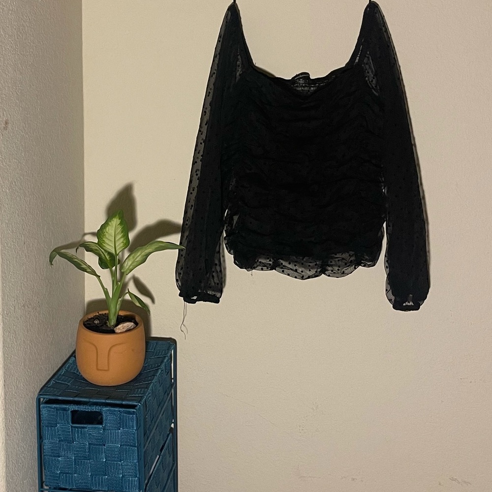 Black polka dot shirt